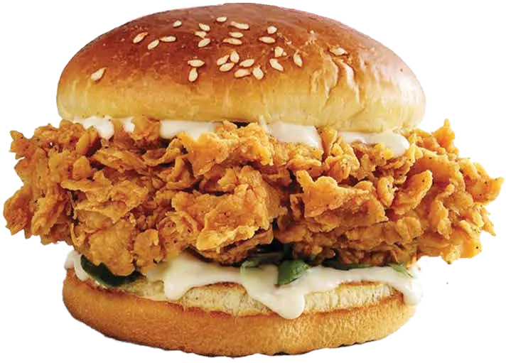 Crispy chicken fillet burger with lettuce and creamy sauce in a sesame bun